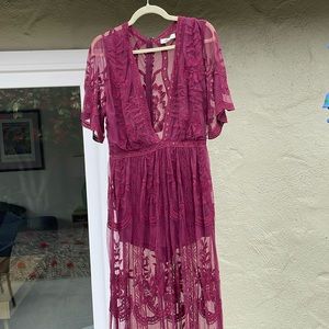 Worn once to a wedding. Super sexy and easy to dance in. Romper shorts inside